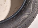 a close up of a tire on a white surface