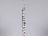a flute that is sitting on top of a stand