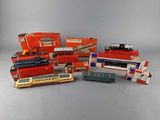 a lot of toy trains that are sitting on a table