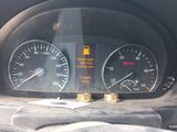 a close up of a speedometer and gauges in a car