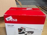 the box of a vacuum cleaner is sitting on the table