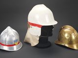 three different types of helmets on display on a black background