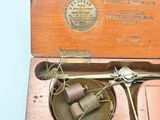 a box with a pair of scissors inside of it