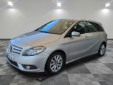 the mercedes b - class is parked on a checkered floor