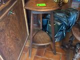a small table and chair in the corner of a room
