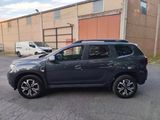 a picture of a grey suv parked in a parking lot
