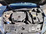 the engine of a car with its hood open and the hood open