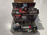 a box of power tools on a pallet next to a box of boxes