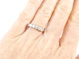 an image of a woman ' s hand with a diamond ring on it