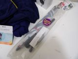 a pair of scissors sitting on a table next to a bag