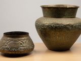 two vases that are sitting on a table