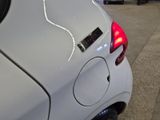 a white car with a sticker on the back of it