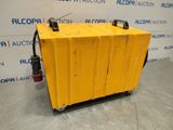 a yellow pallet sitting on top of a floor next to a wall