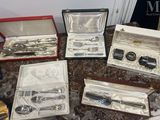 a lot of silverware in a case on a table