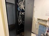 an image of a server in a room with a lot of wires in it