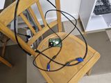 a wooden chair with a computer on top of it