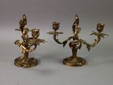 pair of antique brass candelabs with flowers and leaves