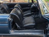 a blue car with black leather seats in the back of it