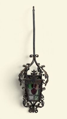 a small metal object hanging on the wall