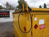 a yellow dumpster with a hose attached to it