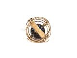 an image of a gold ring with a blue stone in it