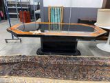 a table with a chair and a rug on the floor