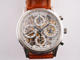 a close up of a watch with a brown leather strap