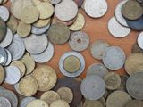 a lot of coins that are on the table