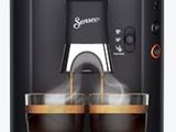 une machine à café Philips avec deux tasses de café devant elle