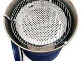 an image of a grill with a basket on top of it