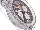 a close up of a watch on a metal bracelet