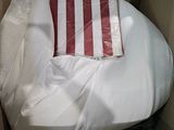 a pillow that is in a box with a pillow on it