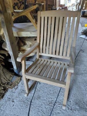 a wooden chair that is sitting in a room