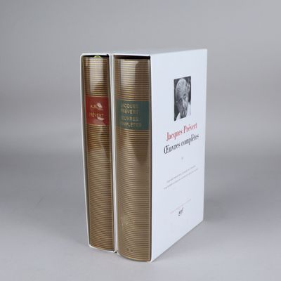 the two books are sitting in the box on the table