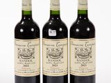 three bottles of wine sitting next to each other on a white surface