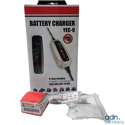 a box with a battery charger in it on a white background