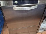 a dishwasher that is sitting in the middle of a kitchen