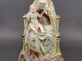 an image of a statue of a woman holding a child