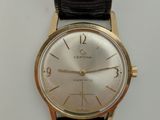 une image d'une montre-bracelet en or avec un bracelet en cuir noir