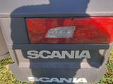a shadow of a person on the back of a car