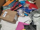 a cardboard box full of assorted items that are in it