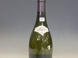 a bottle of wine that is sitting on a table
