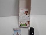 a box with a picture of a woman in a bathing suit next to a cell phone