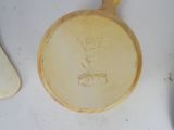 a yellow pan with a handle sitting on a table