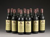 six bottles of wine are lined up in a row