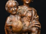an image of a statue of a woman holding a child