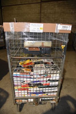 a metal cart with many items in it in a warehouse