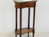 a wooden table with a glass top on it