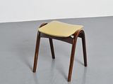 an image of a wooden chair with a yellow seat