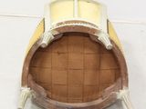 a wooden barrel with a window on top of it